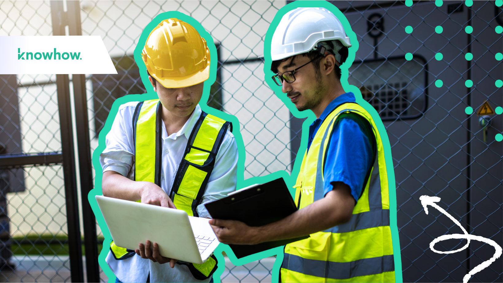 Two construction workers with laptops in a commercial construction site