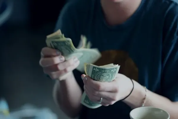 A person sorting through cash.