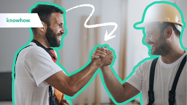 two construction workers giving each other a high five